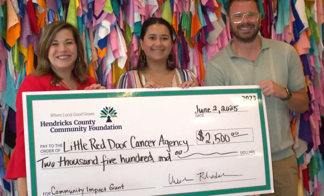 Little Red Door_2025_Community Impact Grant_Unrestricted_ Big Check Pres 2.jpg