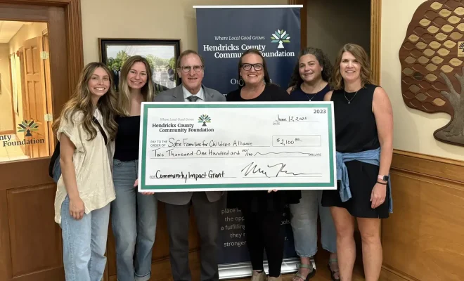 Safe Families_2025_Community Impact Grant_Unrestricted_Big Check Pres.jpg